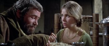 Movie still from “The Lion in Winter” (1968), directed by Anthony Harvey – A man and a woman sitting at a dinner table; Close Up shot, Over the shoulder angle