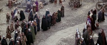 Movie still from “The Lion in Winter” (1968), directed by Anthony Harvey – A group of people dressed in medieval garb; Wide shot, High angle