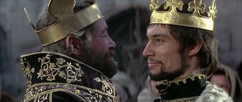 Movie still from “The Lion in Winter” (1968), directed by Anthony Harvey – Two men in gold and black crowns facing each other; Close Up shot, Over the shoulder angle