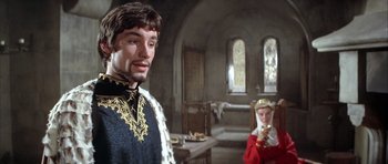 Movie still from “The Lion in Winter” (1968), directed by Anthony Harvey – A man and a woman in a room with tables and chairs; Medium shot, Over the shoulder angle