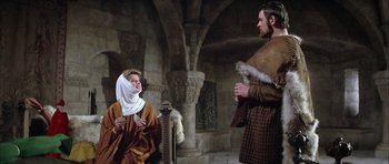 Movie still from “The Lion in Winter” (1968), directed by Anthony Harvey – A man and a woman dressed in medieval garb; Medium shot, Low angle