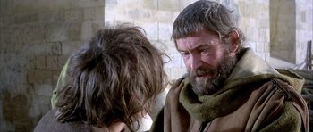 Movie still from “The Lion in Winter” (1968), directed by Anthony Harvey – A man with long hair and a beard talking to another man; Close Up shot, Over the shoulder angle