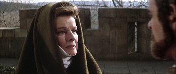 Movie still from “The Lion in Winter” (1968), directed by Anthony Harvey – A woman wrapped in a blanket and looking at the camera; Close Up shot, Low angle