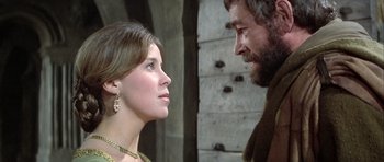 Movie still from “The Lion in Winter” (1968), directed by Anthony Harvey – A man and a woman looking at one another; Close Up shot, Low angle
