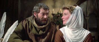 Movie still from “The Lion in Winter” (1968), directed by Anthony Harvey – A man and a woman are sitting next to each other; Medium shot, Over the shoulder angle