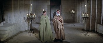 Movie still from “The Lion in Winter” (1968), directed by Anthony Harvey – Two women dressed in medieval clothing standing in a room; Wide shot, High angle
