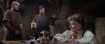 Movie still from “The Lion in Winter” (1968), directed by Anthony Harvey – A man and a woman sitting at a dinner table; Medium shot, Over the shoulder angle