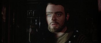 Movie still from “The Lion in Winter” (1968), directed by Anthony Harvey – A person with a beard looking at the camera; Close Up shot, Over the shoulder angle