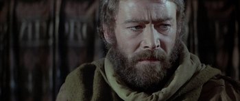 Movie still from “The Lion in Winter” (1968), directed by Anthony Harvey – An old man with a beard and a mustache; Close Up shot, Over the shoulder angle