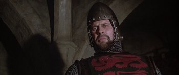Movie still from “The Lion in Winter” (1968), directed by Anthony Harvey – A person wearing a suit of armor; Close Up shot, Low angle