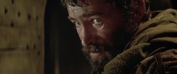 Movie still from “The Lion in Winter” (1968), directed by Anthony Harvey – A person with a beard looking at the camera; Close Up shot, Over the shoulder angle