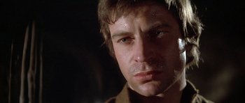 Movie still from “The Lion in Winter” (1968), directed by Anthony Harvey – A man's face in a dark room; Close Up shot, Low angle