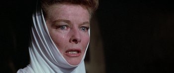 Movie still from “The Lion in Winter” (1968), directed by Anthony Harvey – A person with a bandage on their face; Close Up shot, Over the shoulder angle