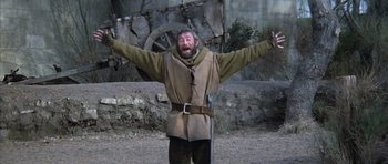 Movie still from “The Lion in Winter” (1968), directed by Anthony Harvey – A man with a beard wearing a medieval outfit; Medium shot, Low angle