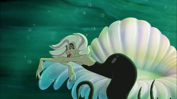 Movie still from “The Little Mermaid II: Return to the Sea” (2000), directed by Bill Speers – A cartoon picture of a woman swimming in the ocean; Medium shot, High angle
