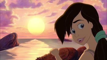 Movie still from “The Little Mermaid II: Return to the Sea” (2000), directed by Bill Speers – A girl is standing in front of the ocean at sunset; Close Up shot, Low angle