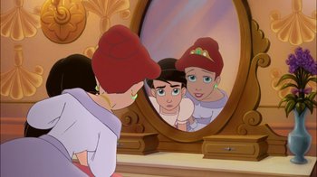 Movie still from “The Little Mermaid II: Return to the Sea” (2000), directed by Bill Speers – A woman looking in a mirror with a boy and a girl; Medium shot, Over the shoulder angle