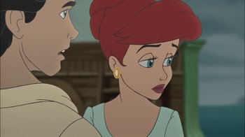 Movie still from “The Little Mermaid II: Return to the Sea” (2000), directed by Bill Speers – A woman with red hair is looking at a man with blue eyes; Close Up shot, Over the shoulder angle