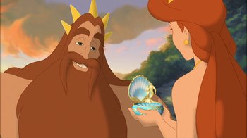 Movie still from “The Little Mermaid: Ariel's Beginning” (2008), directed by Peggy Holmes – An animated picture of a man and a woman holding a shell; Medium shot, Over the shoulder angle