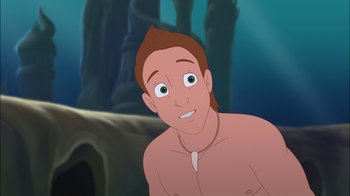 Movie still from “The Little Mermaid: Ariel's Beginning” (2008), directed by Peggy Holmes – A man with no shirt is looking at the camera; Close Up shot, Over the shoulder angle