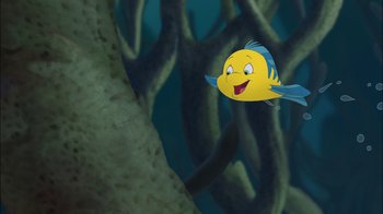 Movie still from “The Little Mermaid: Ariel's Beginning” (2008), directed by Peggy Holmes – A cartoon of a fish swimming in the water; Wide shot, Low angle
