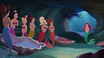 Movie still from “The Little Mermaid: Ariel's Beginning” (2008), directed by Peggy Holmes – A group of mermaids standing next to each other in the water; Wide shot, High angle