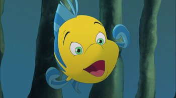 Movie still from “The Little Mermaid: Ariel's Beginning” (2008), directed by Peggy Holmes – A cartoon of a yellow fish with blue fins; Medium shot, Overhead angle