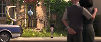 Movie still from “The Little Prince” (2015), directed by Mark Osborne – An animated scene of a little girl standing on the sidewalk; Wide shot, Over the shoulder angle