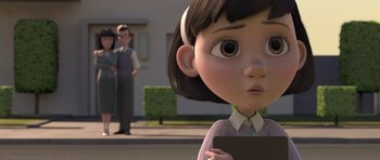 Movie still from “The Little Prince” (2015), directed by Mark Osborne – An animated girl is looking at the camera while a man and a woman look on; Close Up shot, Over the shoulder angle