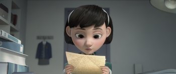 Movie still from “The Little Prince” (2015), directed by Mark Osborne – A girl holding a piece of paper in her hands; Close Up shot, Over the shoulder angle