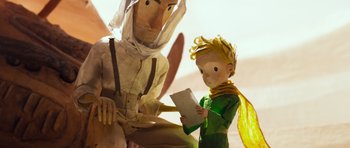 Movie still from “The Little Prince” (2015), directed by Mark Osborne – A paper - mache statue of a person and a paper - mache doll; Medium shot, Over the shoulder angle