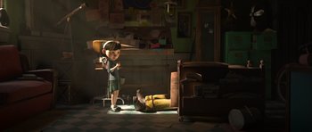 Movie still from “The Little Prince” (2015), directed by Mark Osborne – A little girl standing next to a boy laying on the floor; Wide shot, High angle
