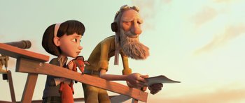 Movie still from “The Little Prince” (2015), directed by Mark Osborne – An old man and a young boy are looking at a piece of paper; Medium shot, Low angle