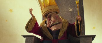 Movie still from “The Little Prince” (2015), directed by Mark Osborne – A paper mache mask of a man wearing a crown; Close Up shot, Low angle