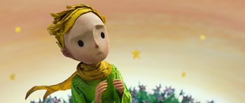 Movie still from “The Little Prince” (2015), directed by Mark Osborne – A paper mache doll with a yellow bandanna around it's head; Close Up shot, Low angle