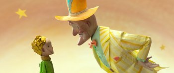 Movie still from “The Little Prince” (2015), directed by Mark Osborne – A man in a yellow suit and a boy in a yellow hat; Close Up shot, Over the shoulder angle