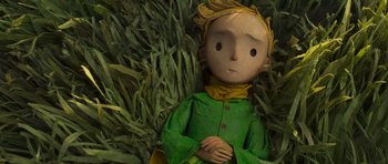 Movie still from “The Little Prince” (2015), directed by Mark Osborne – A doll of the little prince is laying in the grass; Close Up shot, Overhead angle