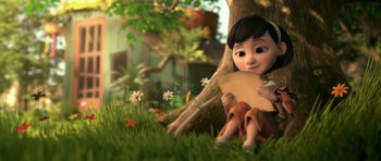 Movie still from “The Little Prince” (2015), directed by Mark Osborne – An animated girl sitting in the grass holding a piece of paper; Medium shot, Low angle