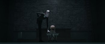 Movie still from “The Little Prince” (2015), directed by Mark Osborne – A man standing next to a child in front of a chalkboard; Wide shot, Over the shoulder angle