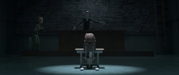 Movie still from “The Little Prince” (2015), directed by Mark Osborne – A person sitting at a desk in front of a chalkboard; Wide shot, Over the shoulder angle