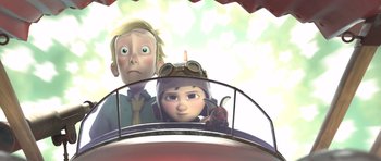Movie still from “The Little Prince” (2015), directed by Mark Osborne – A man and a woman are sitting in a vehicle; Medium shot, Low angle