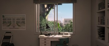 Movie still from “The Little Prince” (2015), directed by Mark Osborne – A desk with a lamp and a chair in front of a large window; Extreme Wide shot, High angle