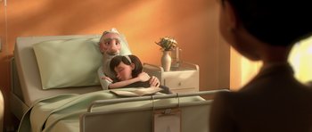 Movie still from “The Little Prince” (2015), directed by Mark Osborne – An animated scene of a woman and a man in a hospital bed; Medium shot, Over the shoulder angle