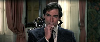 Movie still from “The Living Daylights” (1987), directed by John Glen – A person wearing a suit and tie; Close Up shot, High angle