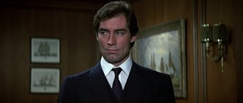 Movie still from “The Living Daylights” (1987), directed by John Glen – A man in a suit and a tie; Close Up shot, Low angle