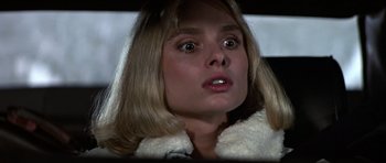 Movie still from “The Living Daylights” (1987), directed by John Glen – A person wearing a jacket; Close Up shot, Over the shoulder angle