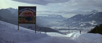 Movie still from “The Living Daylights” (1987), directed by John Glen – A view of a mountain range from the top of a ski slope; Extreme Wide shot, Low angle