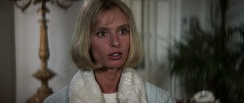 Movie still from “The Living Daylights” (1987), directed by John Glen – A person with short blonde hair; Close Up shot, High angle