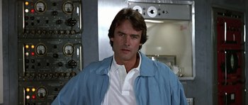 Movie still from “The Living Daylights” (1987), directed by John Glen – A person wearing a blue jacket; Close Up shot, Low angle