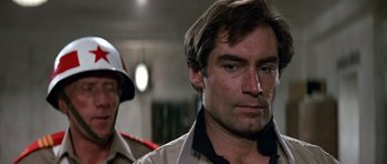 Movie still from “The Living Daylights” (1987), directed by John Glen – A person wearing a uniform; Close Up shot, Low angle